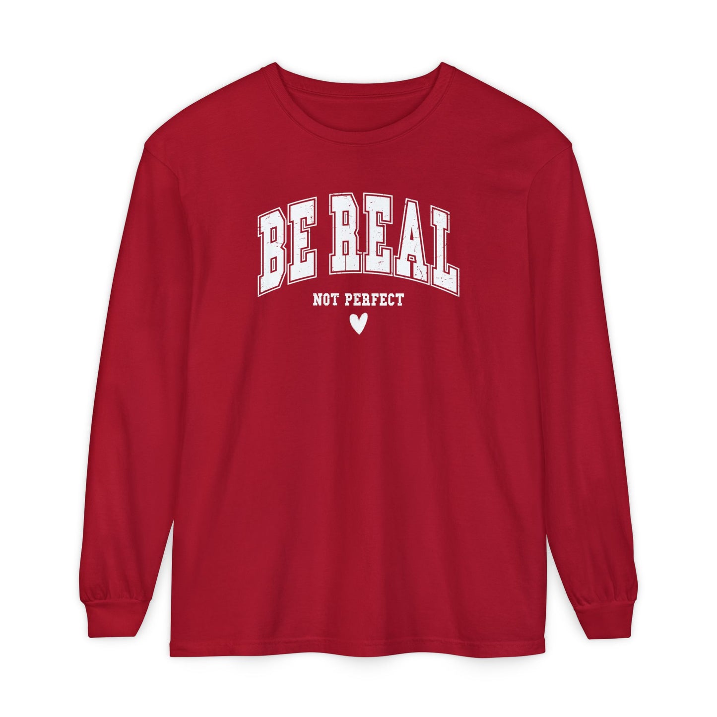 On the front of this custom unisex long sleeve shirt are the words Be Real in large bubble font with the words not perfect underneath the bubble letters, on the bottom there is a heart.