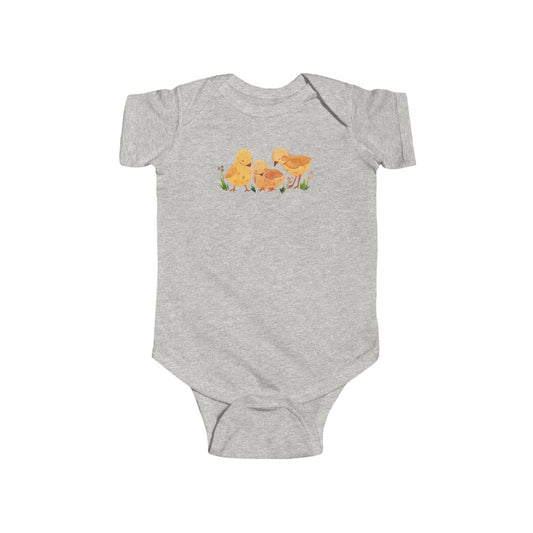 On the front upper part of this custom infant short sleeve onesie is an image of three baby chicks with flowers all around the baby chicks.