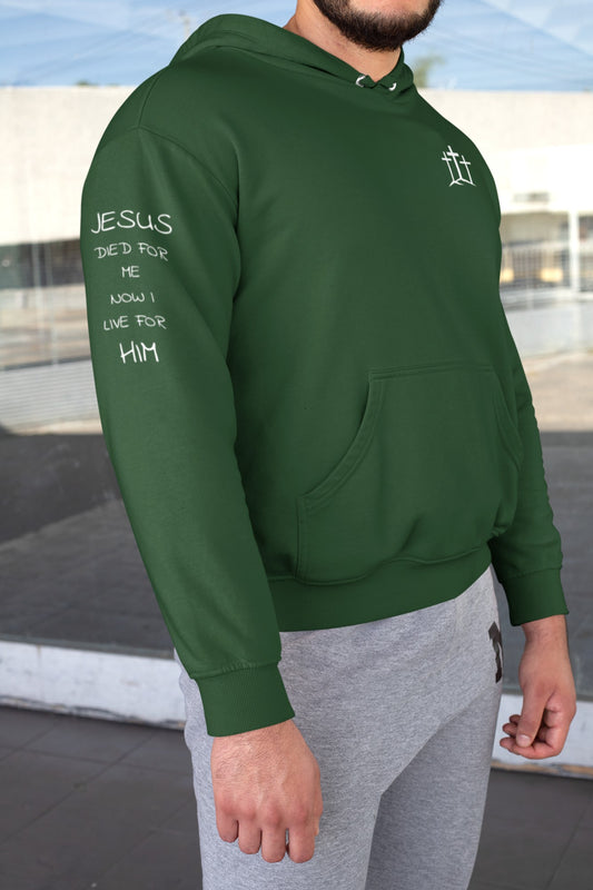 On the front of this custom unisex Christian hoodie are three crosses sitting top of a hill, on the right right arm of the sweater are the words Jesus died for me, now I live for Him in a modern font.