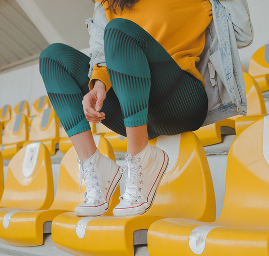 Custom high waisted women's handmade leggings with a custom blue design that features different shades of blue lines that are throughout the pants making the leggings exaggerate a women's curves.