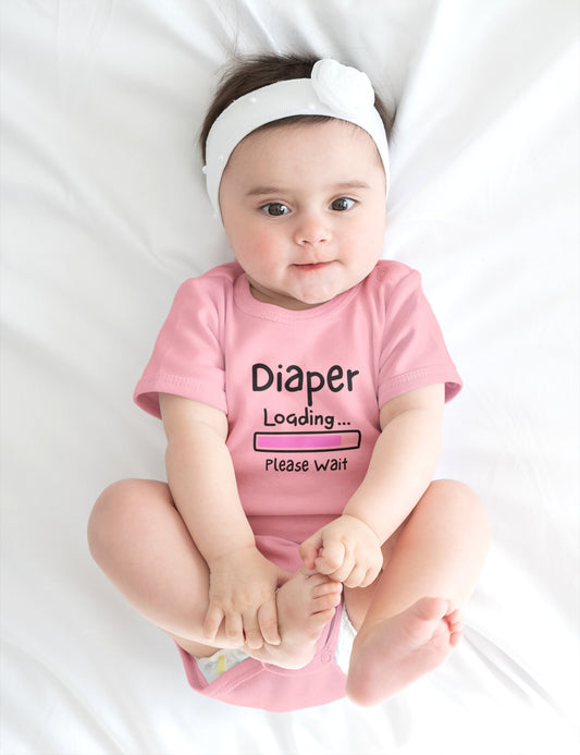 On the front of this custom infant onesie are the words Diaper loading please wait with an image of a battery life bar in pink.