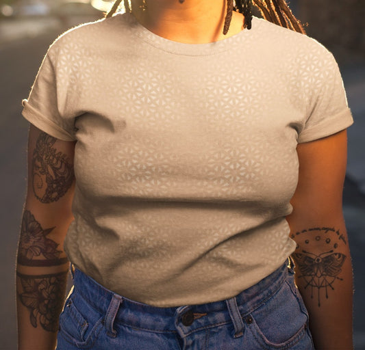 This super soft handmade custom women's shirt is a light beige color with even lighter metallic lines overlayed overtop, it looks like a floral pattern across the entire shirt.