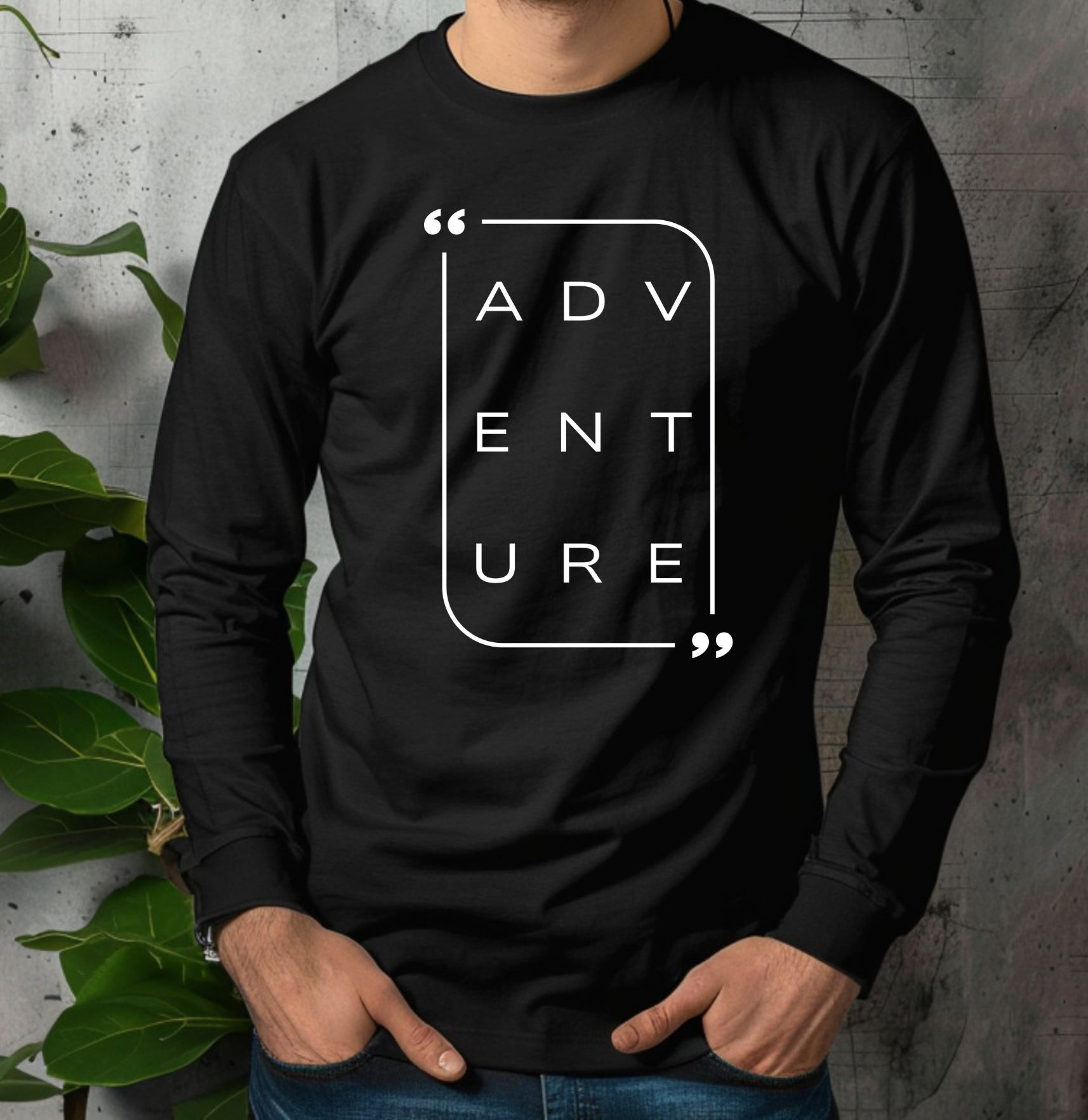 On the front of this super soft unisex long sleeve shirt is the word adventure with there being three letters on each line, it is in a modern font. There is a border around the word.