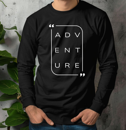 On the front of this super soft unisex long sleeve shirt is the word adventure with there being three letters on each line, it is in a modern font. There is a border around the word.