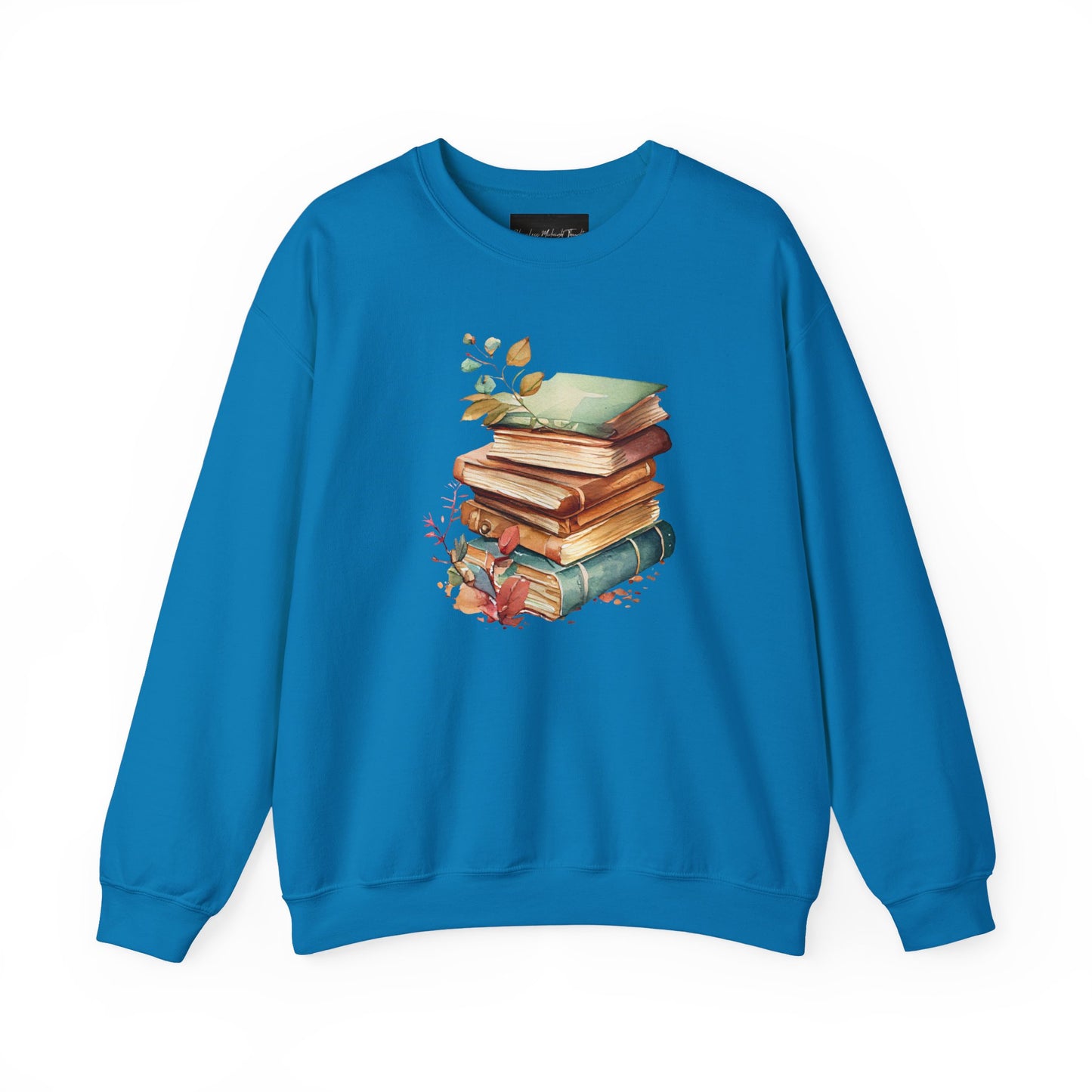 On the front of this custom book lovers sweatshirt is a stack of vintage books with a bunch of wildflowers all around the books.