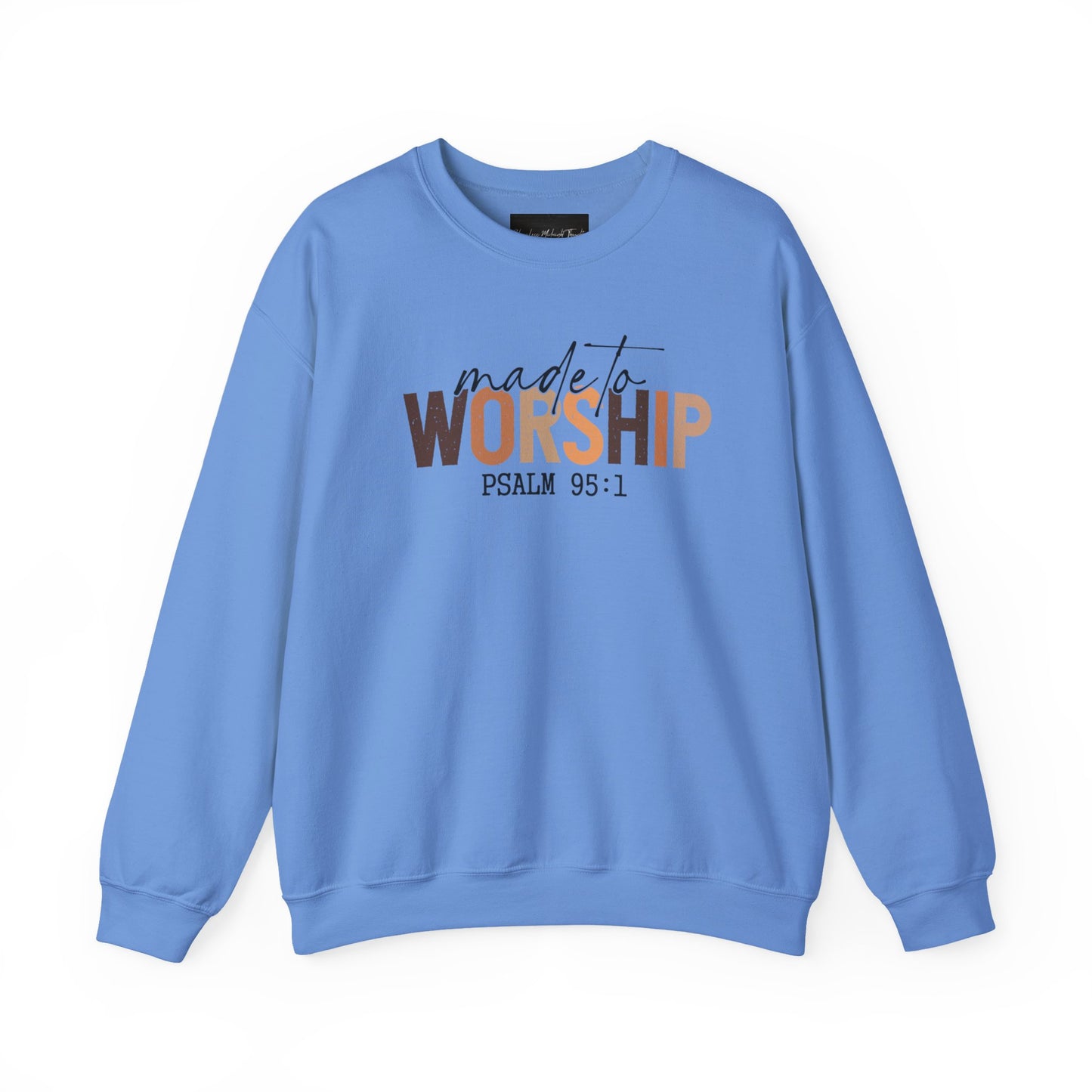 On the front of this Christian pullover sweatshirt it says Made To Worship Psalm 95:1, the word worship is done in large block letters with every letter being a different shade of brown.