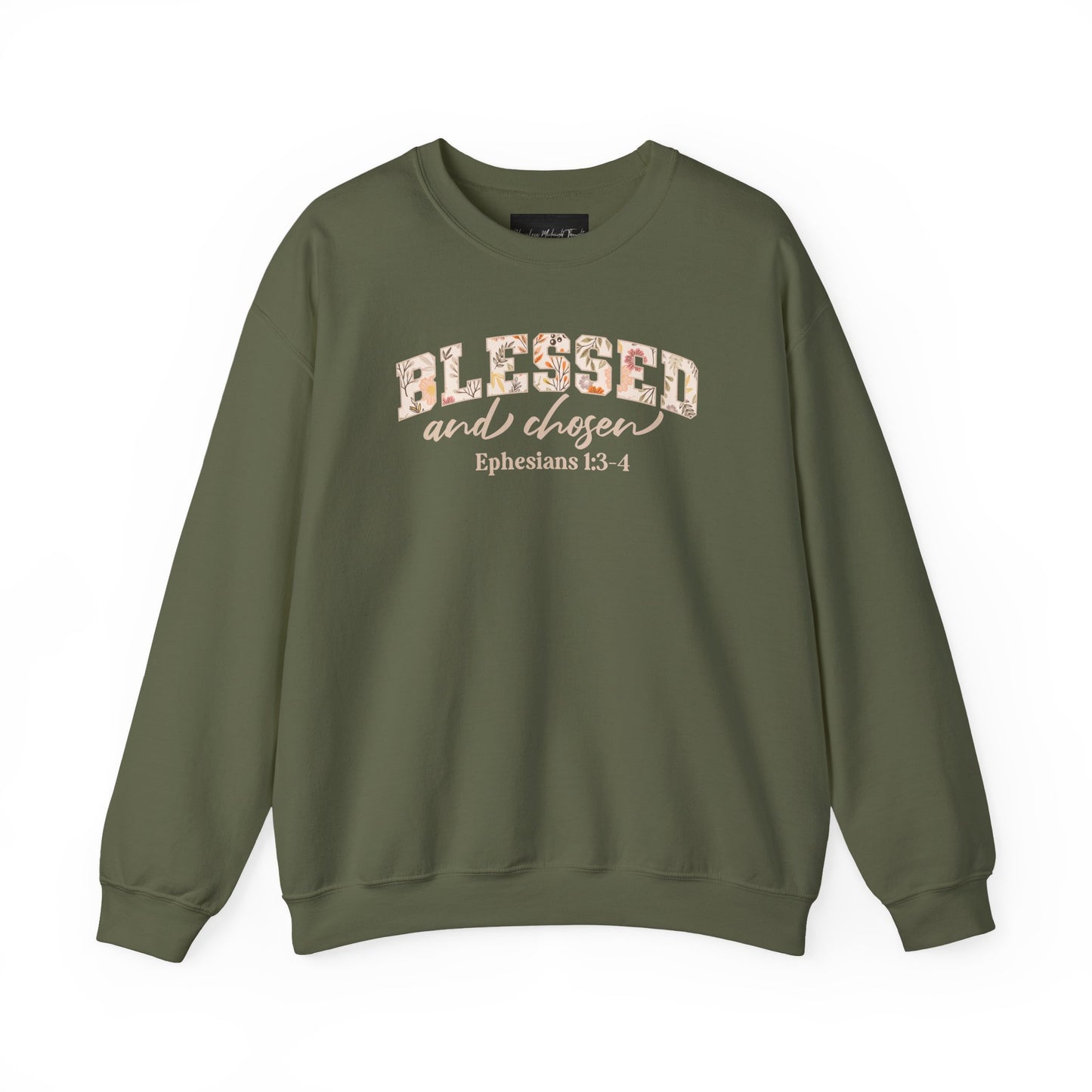 On the front of this custom Christian sweatshirt is the bible verse Blessed and Chosen Ephesians 1:3-4 with the word Blessed being in large bubble letters with a floral pattern on the inside of the letters.