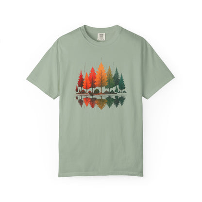 On the front of this custom comfort colors short sleeve shirt is a image of trees in the fall time with all the different fall colors, the trees reflection is right underneath making them look like they are above water.