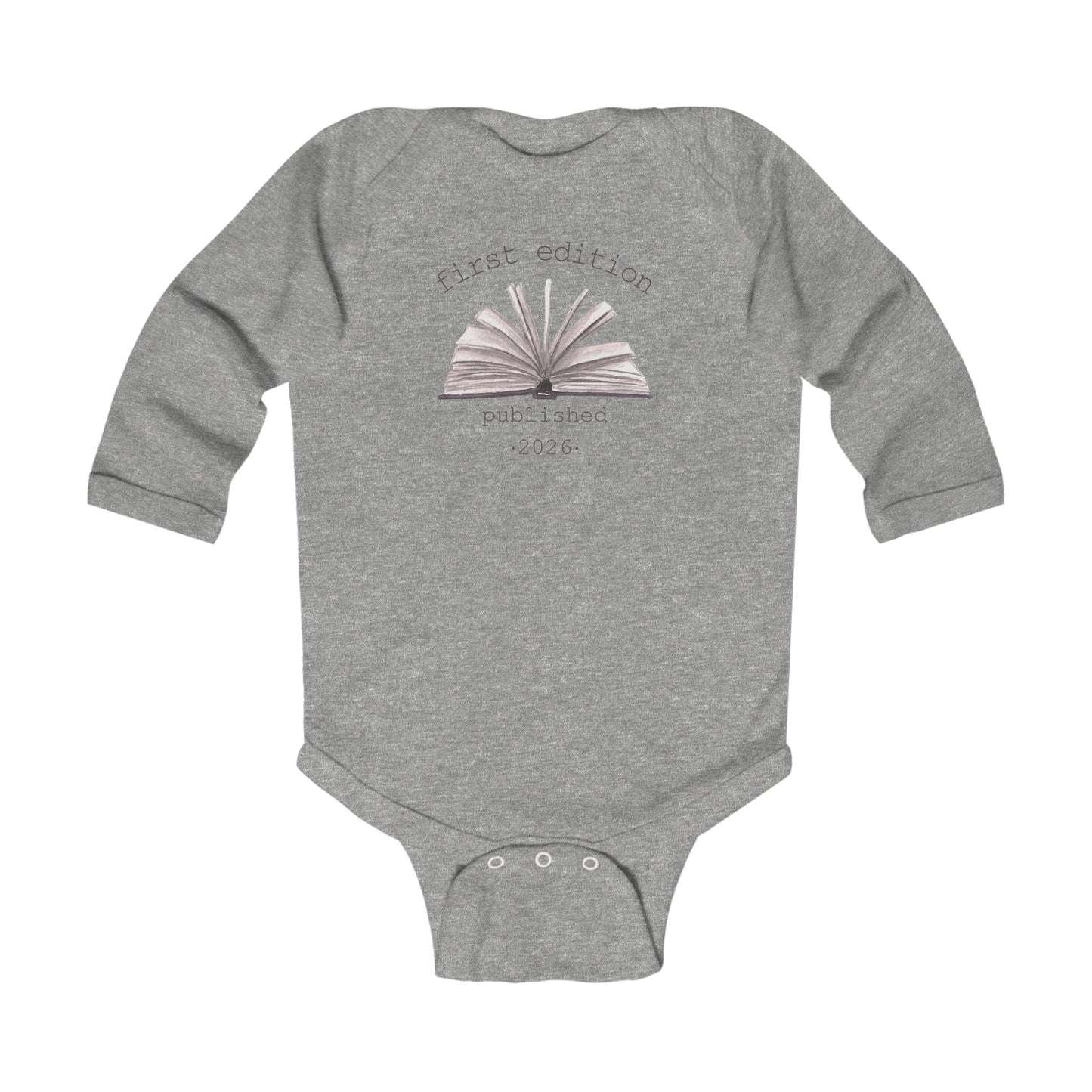 On the front of this custom baby onesie are the words First Edition Published 2026 with an image of an open book in the middle of the wording.