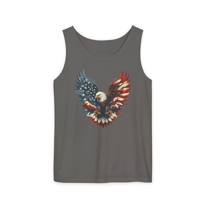 On the front of this unisex tank top is an image of an American Bald Eagle with it's wings out, the feathers of the bald eagle are the colors of the American flag being red, white and blue, there are also stars on one side of the eagle’s wings.