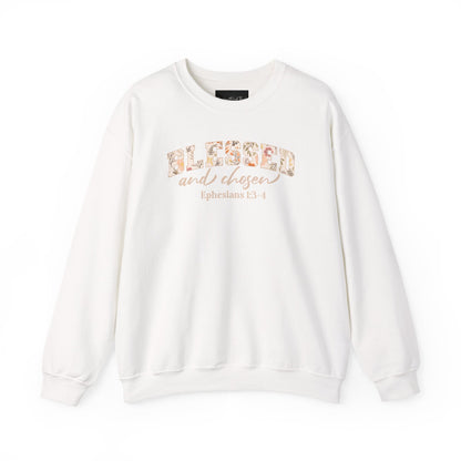 On the front of this custom Christian sweatshirt is the bible verse Blessed and Chosen Ephesians 1:3-4 with the word Blessed being in large bubble letters with a floral pattern on the inside of the letters.