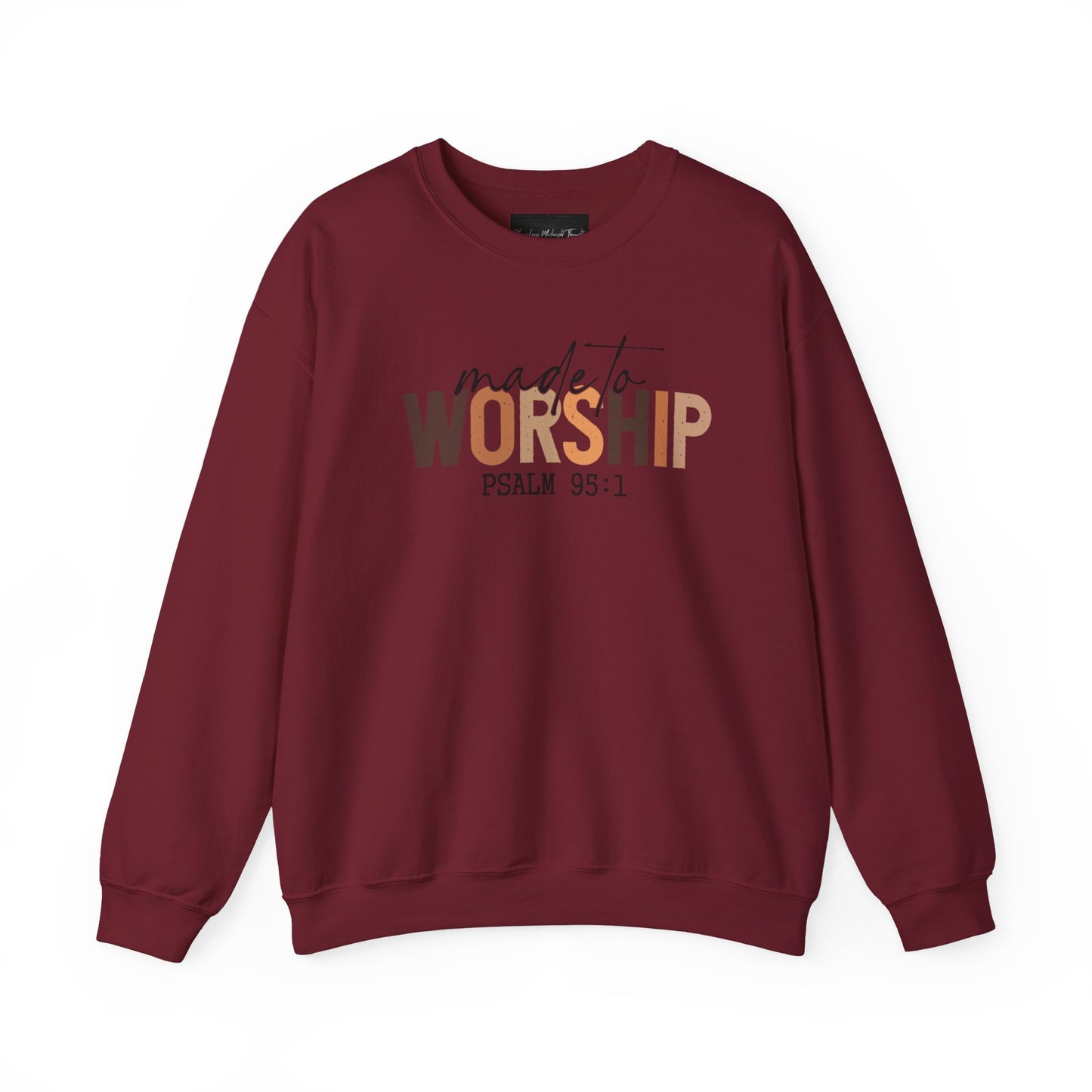 On the front of this Christian pullover sweatshirt it says Made To Worship Psalm 95:1, the word worship is done in large block letters with every letter being a different shade of brown.