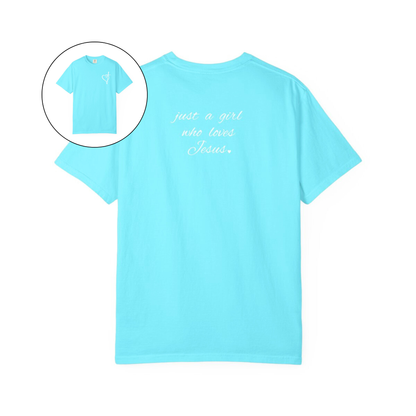 On the front of this custom women's Christian t-shirt is a heart with a cross through it, on the back top of the shirt right between the shoulder blades are the words just a girl who loves Jesus in a cursive writing.