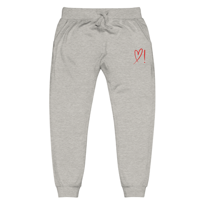 A pair of super soft ankle length unisex sweatpants, there are two pockets on the front and one pocket on the back right. There is a red heart with an exclamation point next to it embroidered on the front left pocket.