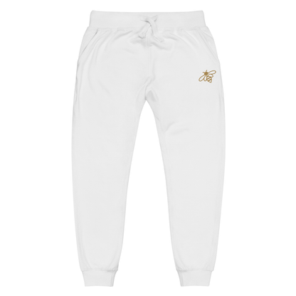 A pair of super soft fleece unisex sweatpants with a bumble bee embroidered in gold over the left front pocket of the pants.