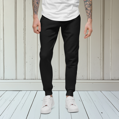 A pair of super soft custom unisex fleece sweatpants with a male lion head on the back calf of the right leg embroidered in silver.