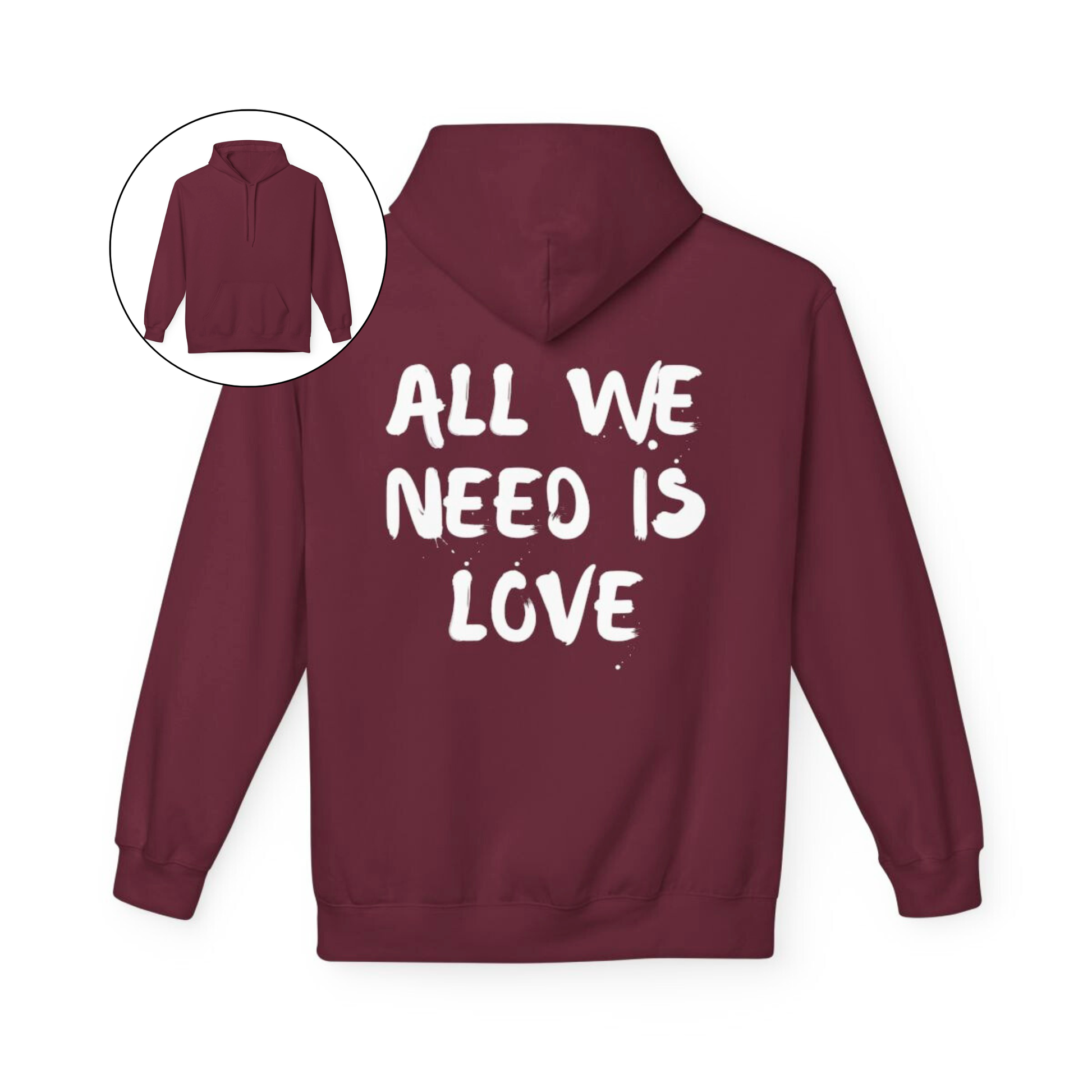 On the back of this custom unisex hoodie are the words all we need is love, the words look like they have been spray painted onto the sweater.