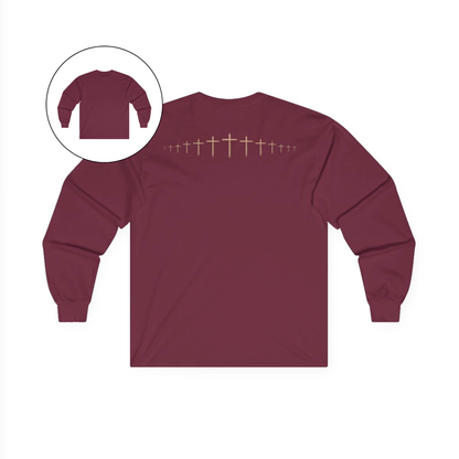 On the back of this maroon colored Christian long sleeve shirt is a large wooden Jesus cross in between the shoulder blades, the Jesus cross then keeps getting smaller and smaller till it fades right off the shirt giving it a amazing 3D look on the back.