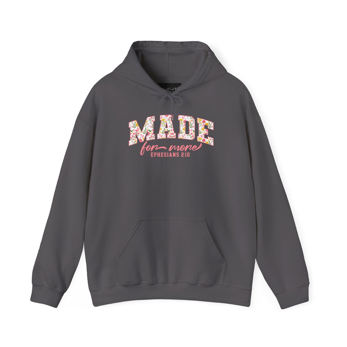 On the front of this custom Christian hoodie is the bible verse the says Made for more Ephesians 2:10, with the word "Made" being large block letters with a pink floral pattern inside the letters, all the other words are in a light pink color.