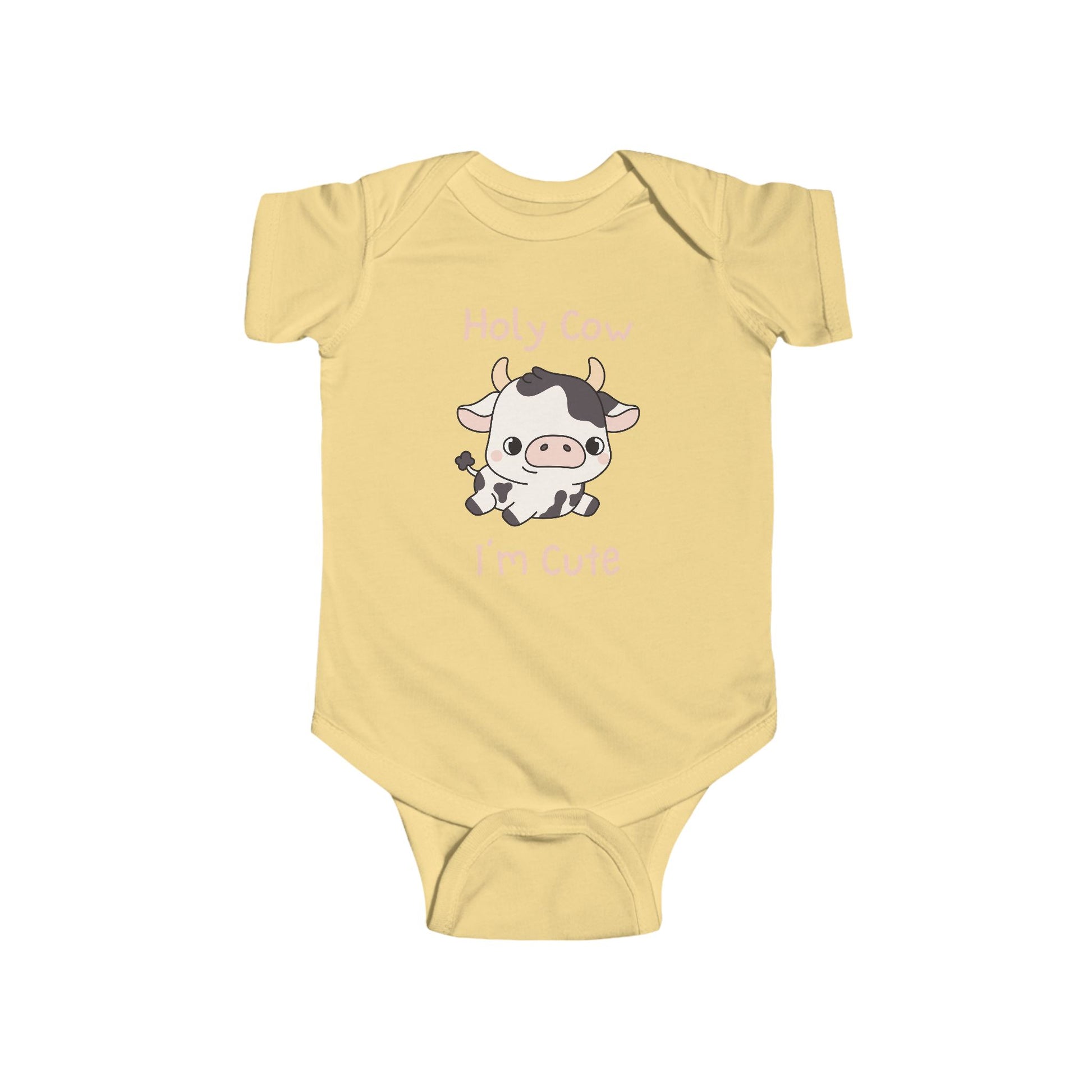 This adorable pink colored super soft bodysuit features an image of a baby cow in the middle with the words 'holy cow I'm cute' in light beige lettering around the image.