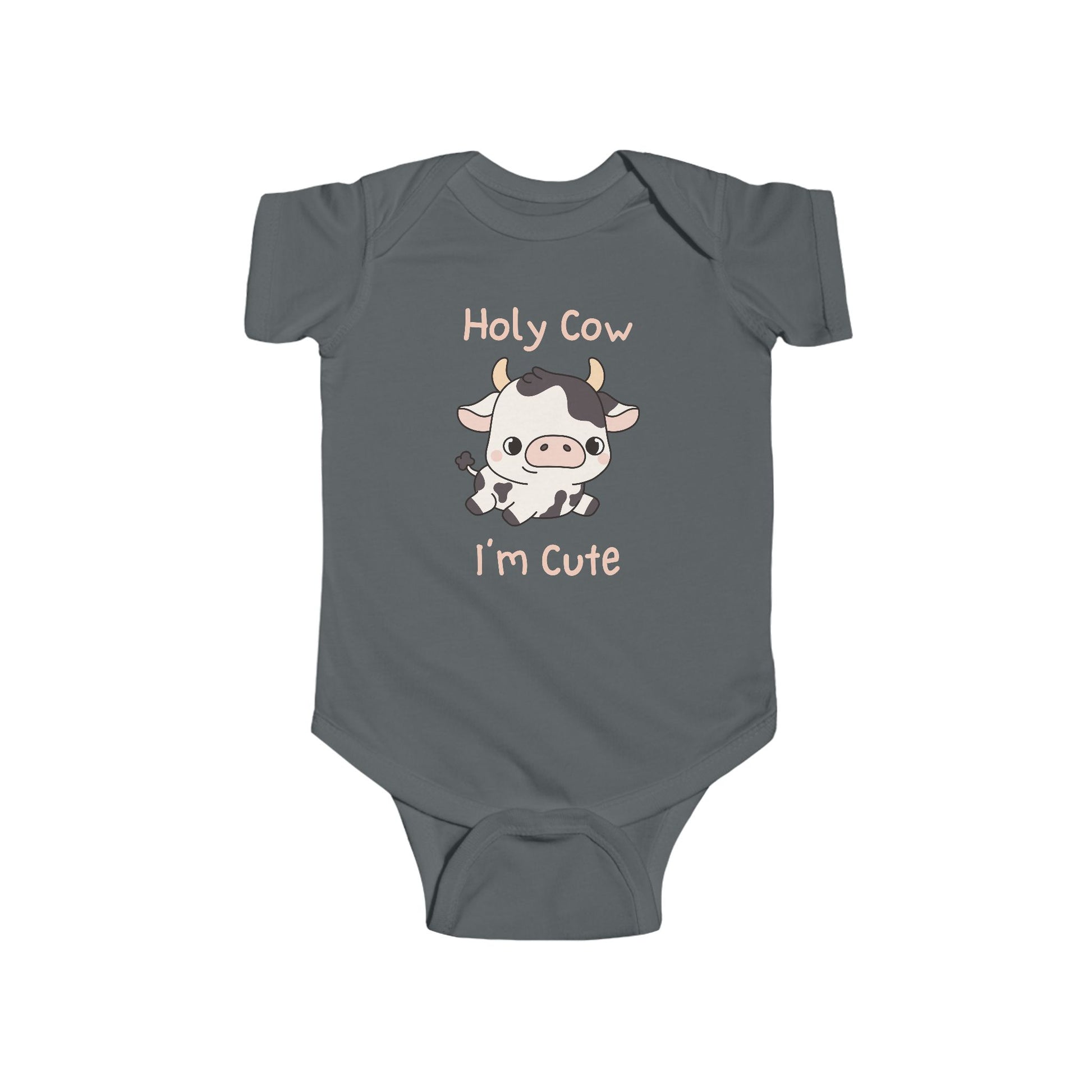 This adorable pink colored super soft bodysuit features an image of a baby cow in the middle with the words 'holy cow I'm cute' in light beige lettering around the image.