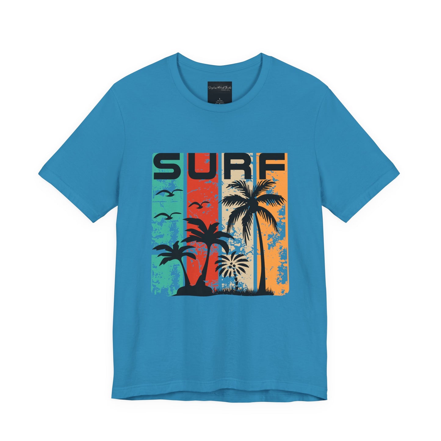 On the front of this custom vacation shirt is the word SURF in large letters at the top of the shirt, each letter has a different colored line through it to the bottom, there are images of palm trees and birds flying underneath the word.