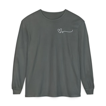On the top right chest of this custom long sleeve t-shirt is a heart with a trail behind it signifying a heartbeat that you would see on a heart monitor. Perfect for health care workers and teachers.