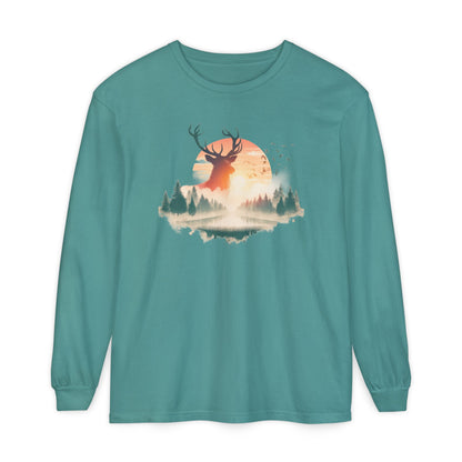 On the front of this custom unisex long sleeve shirt is beautiful landscape at dawn, there is a river in the middle with pine trees on either side, the sun is setting in the background with a large elk in the distance standing in front of the sun.