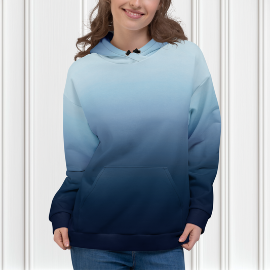 A custom handmade unisex pullover hooded sweatshirt with an ombre design with the top of the hoodie being a very light blue color then it slowly shifting to a navy blue at the bottom of the hoodie.