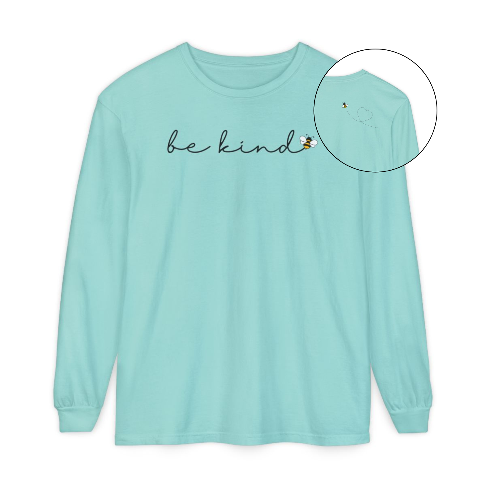 On the front of this custom unisex long sleeve shirt are the words be kind in a simple cursive font, with a bumble bee on the right side of the letter kind, on the back right shoulder there is an image of a bumble bee flying and leaving a trail behind it in the shape of a heart.