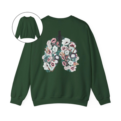 On the back of this women's pullover sweatshirt is an image of a set of lungs, but the lungs are made out of vines with pink and white flowers all over them, there are butterflies sitting in top of the flowers that are light blue in color.