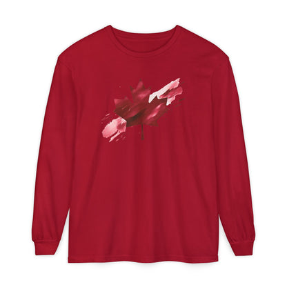 On the front of this unisex long sleeve shirt is an image of a Canadian maple leaf that is bright red, it looks like it has been spray painted onto the front of the shirt.