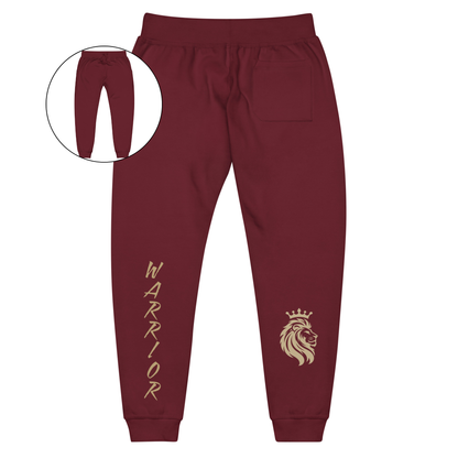 A pair of super soft ankle length unisex sweatpants, there are two pockets on the front and one pocket on the back right, the word warrior is in gold on the back left leg from the knee down and a male lion with a crown on the other