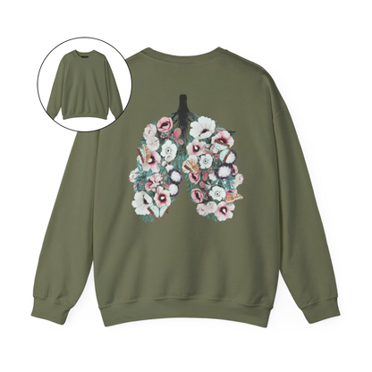 On the back of this women's pullover sweatshirt is an image of a set of lungs, but the lungs are made out of vines with pink and white flowers all over them, there are butterflies sitting in top of the flowers that are light blue in color.