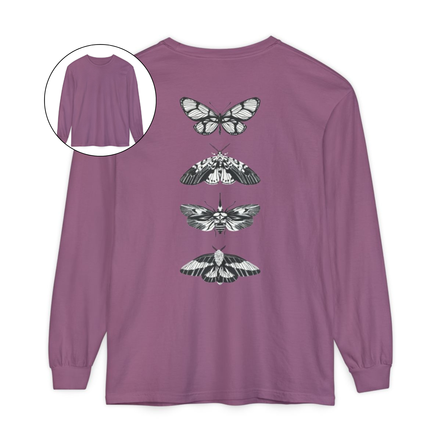 On the back of this long sleeve women's shirt right in between the shoulder blades is a row of black and white butterflies, starting at the top of the back and headed to the bottom of the shirt.