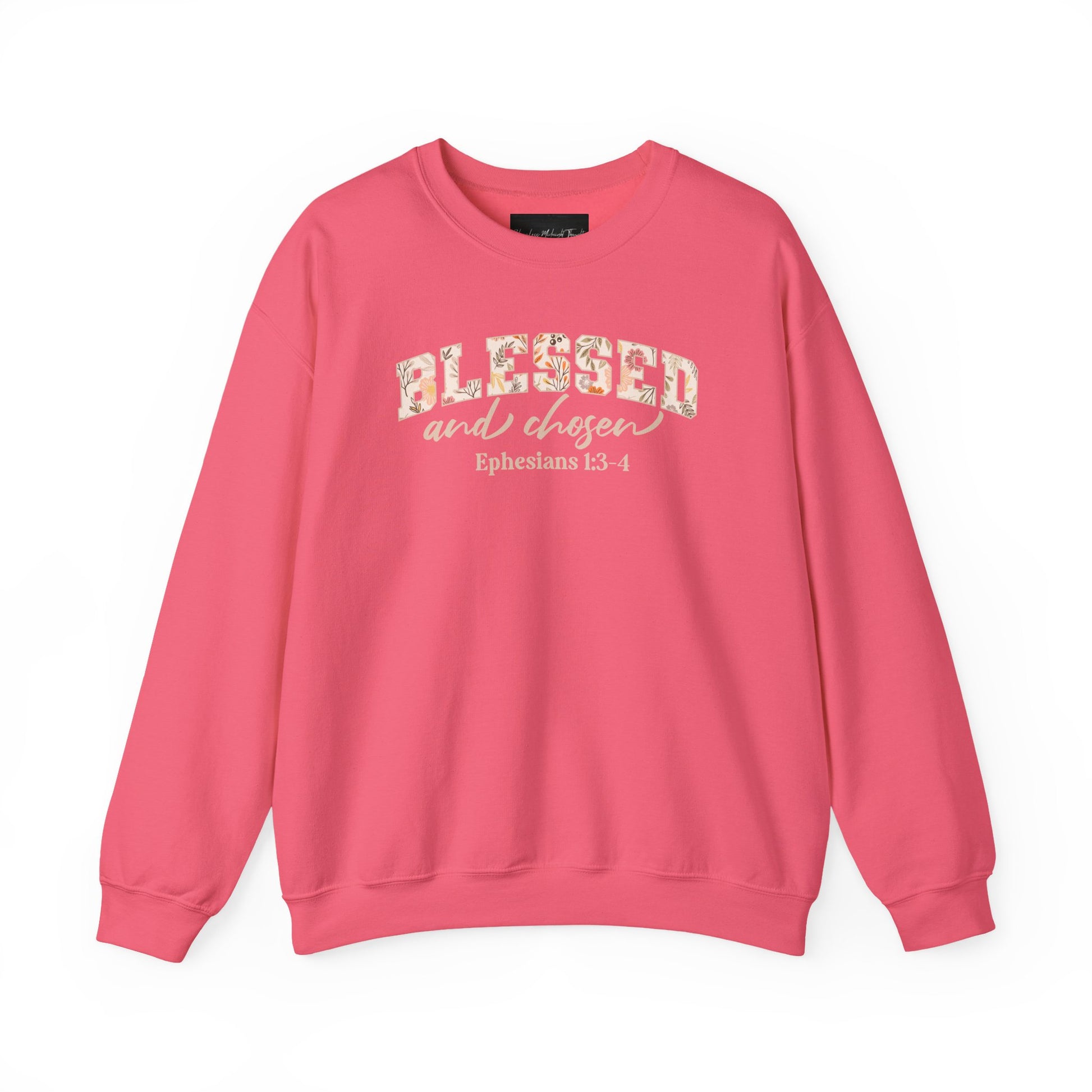 On the front of this custom Christian sweatshirt is the bible verse Blessed and Chosen Ephesians 1:3-4 with the word Blessed being in large bubble letters with a floral pattern on the inside of the letters.
