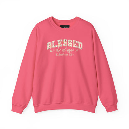 On the front of this custom Christian sweatshirt is the bible verse Blessed and Chosen Ephesians 1:3-4 with the word Blessed being in large bubble letters with a floral pattern on the inside of the letters.