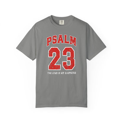 On the front side of this custom vintage t-shirt are the words Psalm 23 The Lord Is My Shepherd, it is with red and white block lettering.