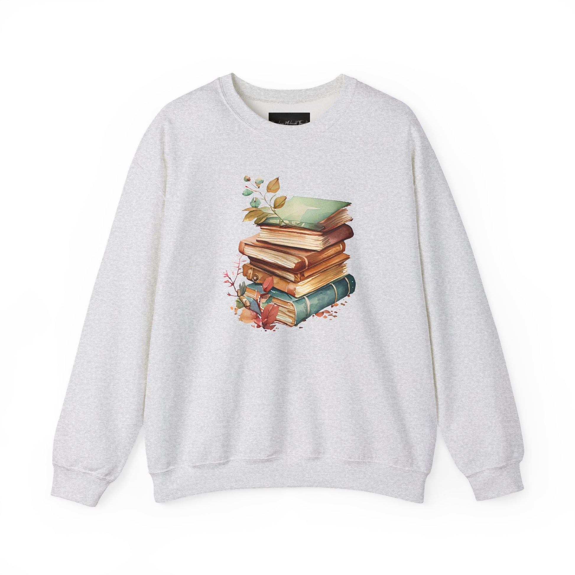 On the front of this custom book lovers sweatshirt is a stack of vintage books with a bunch of wildflowers all around the books.