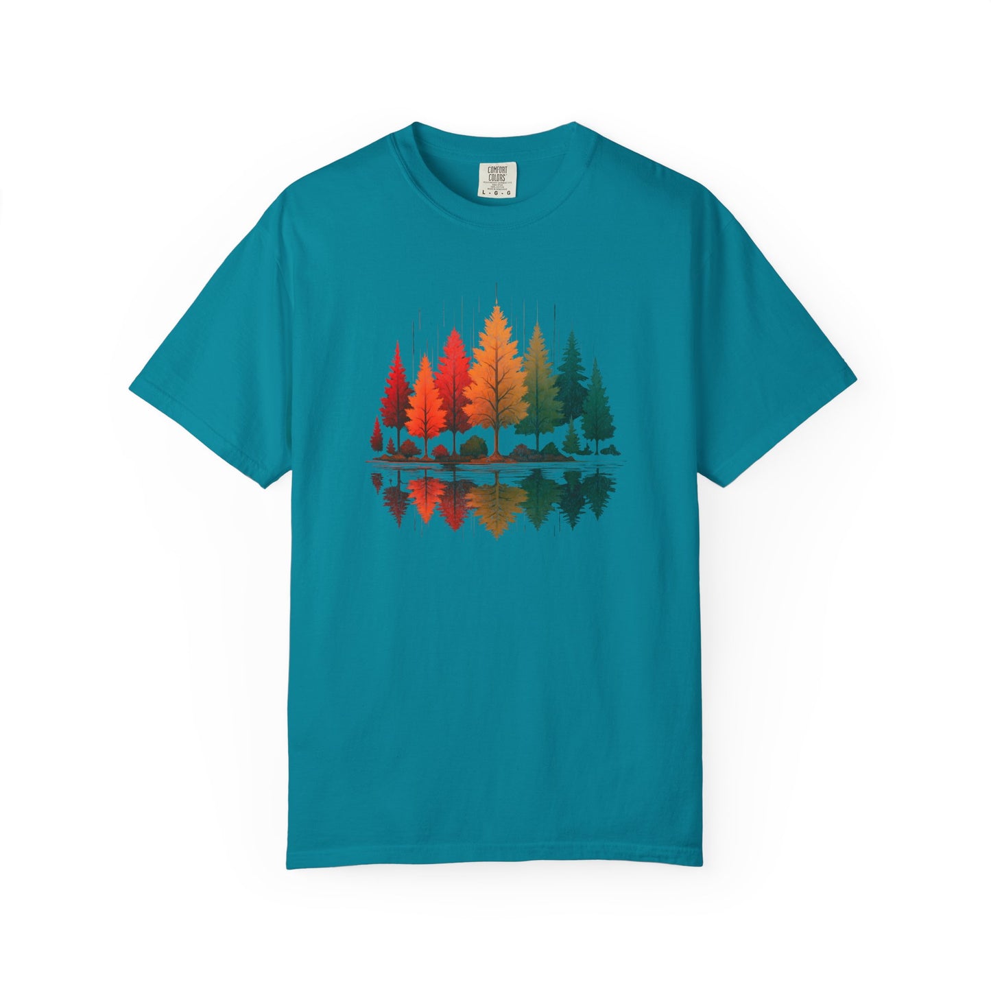 On the front of this custom comfort colors short sleeve shirt is a image of trees in the fall time with all the different fall colors, the trees reflection is right underneath making them look like they are above water.