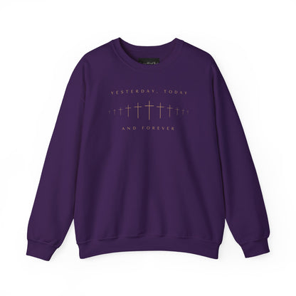 On the front of this Christian pullover sweatshirt is a row of Jesus crosses that look like they are fading into the distance, the words Yesterday, Today and Forever are on the top and the bottom of the crosses.