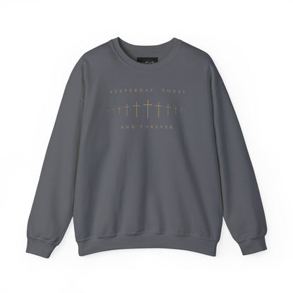 On the front of this Christian pullover sweatshirt is a row of Jesus crosses that look like they are fading into the distance, the words Yesterday, Today and Forever are on the top and the bottom of the crosses.
