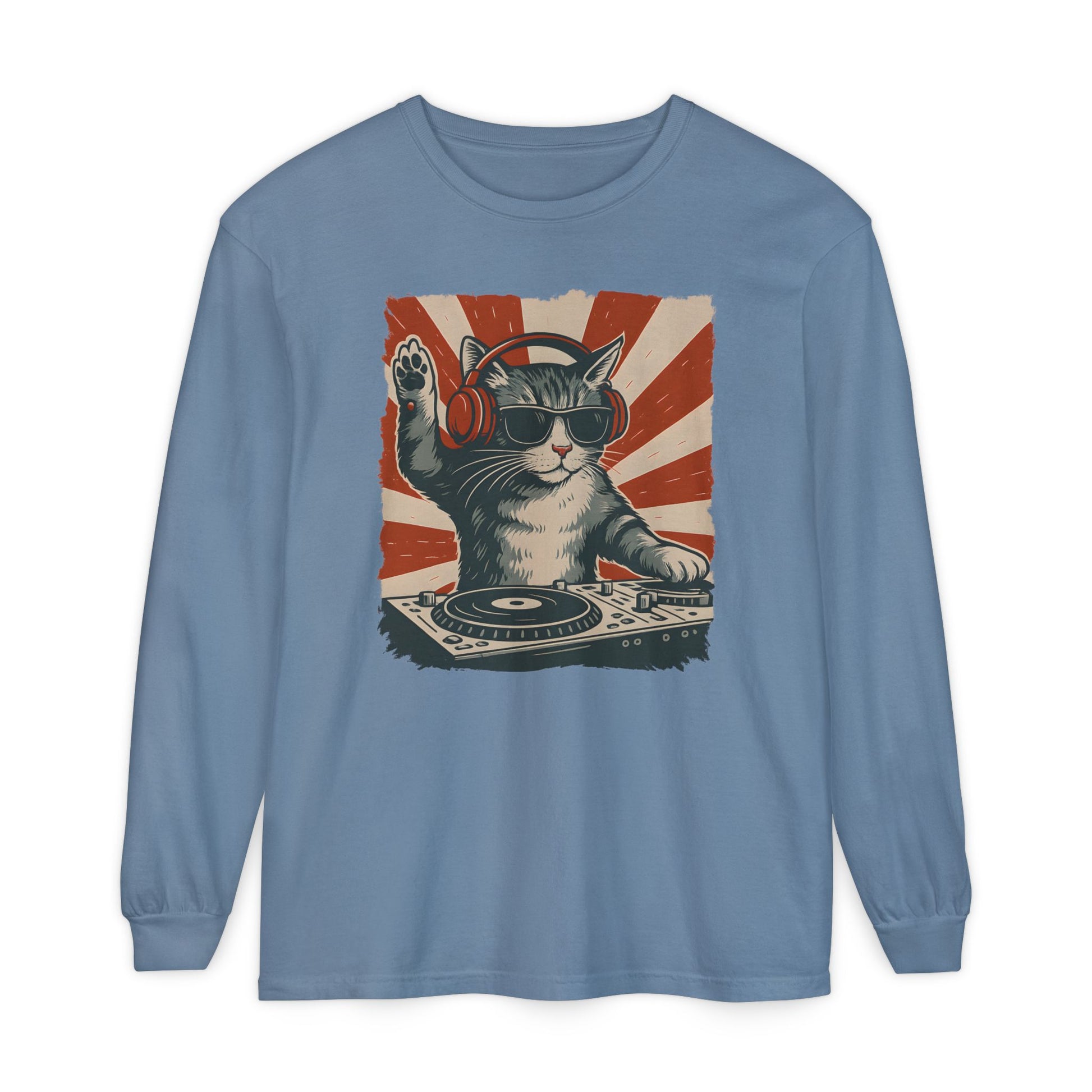 On the front of this custom retro long sleeve shirt is a DJ playing music, except the DJ is a cat that is wearing headphones, there is a vintage red and ivory background behind the cat.