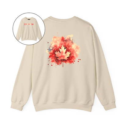 On the front of this Canadian pride pullover sweater is Canada in red and beige letters with a maple leaf in the middle, on the back of the sweater is a large maple leaf that looks like it has been spray painted onto the sweater in red and beige.