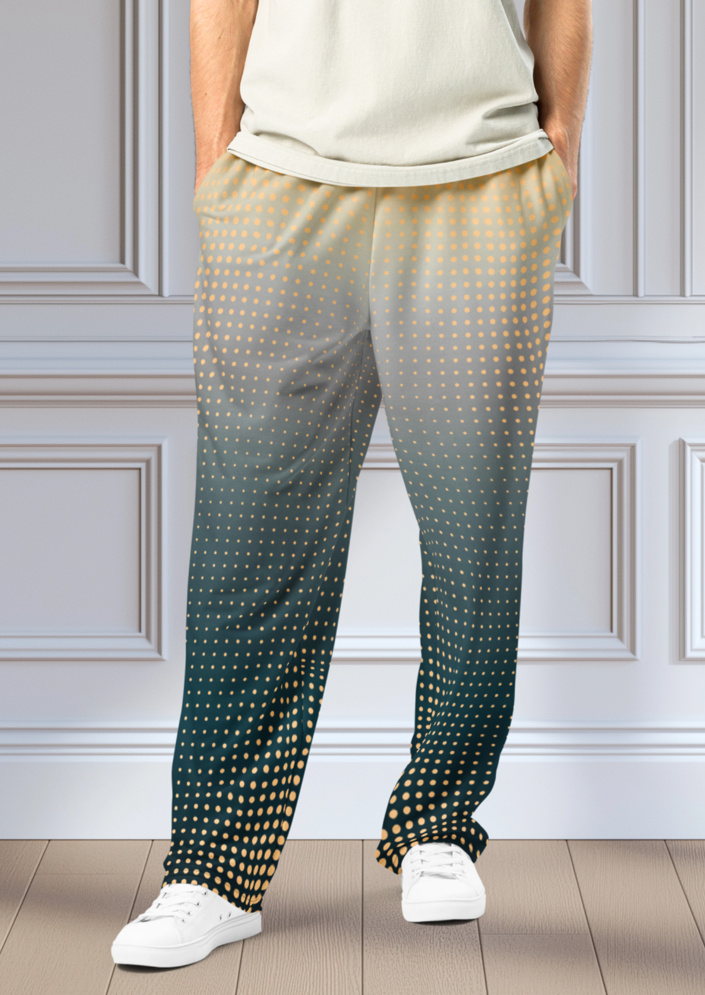 A pair of super soft unisex style wide leg jogger with a ombre pattern that starts as a light orange on the top the fades to a deep teal in the middle of the sweats, there is a polka dot pattern that is light orange throughout the top as well.