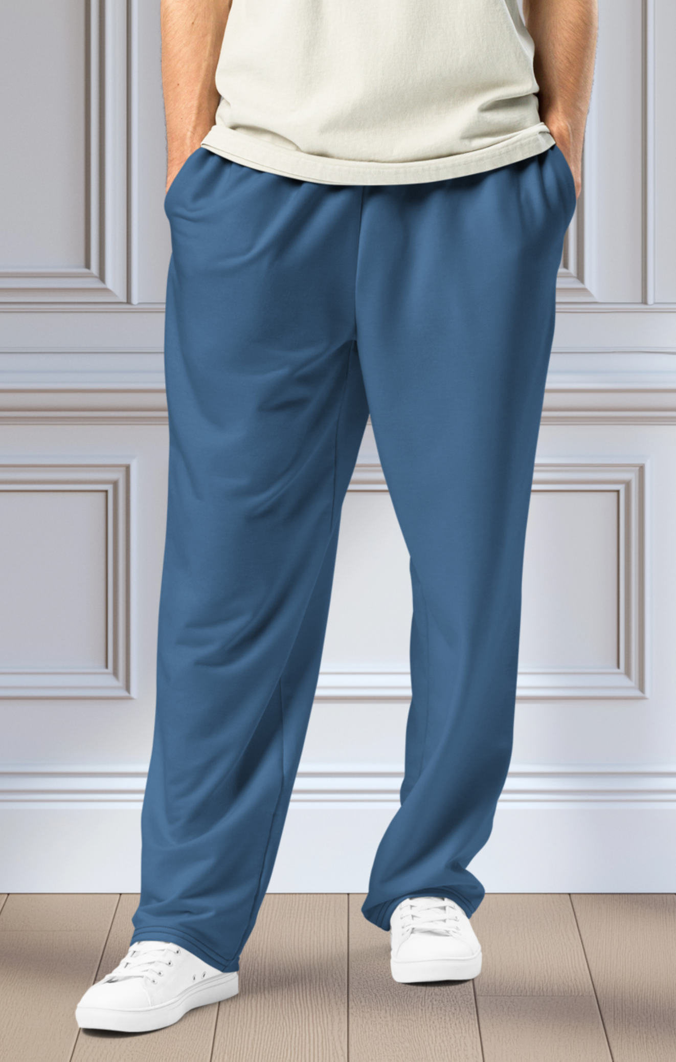 A pair of unisex wide leg joggers that are a ocean blue color from the top to the bottom with the strings of the sweats being black.