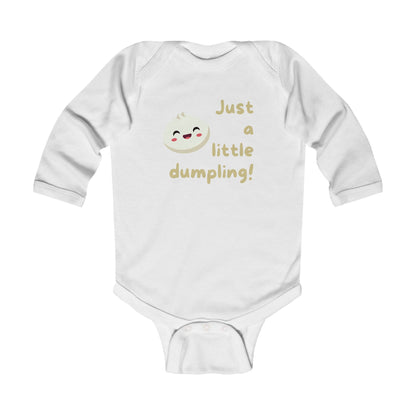 On the front of this custom infant onesie are the words Just A Little Dumpling with a image of a bao dumpling with a happy face next to the wording.