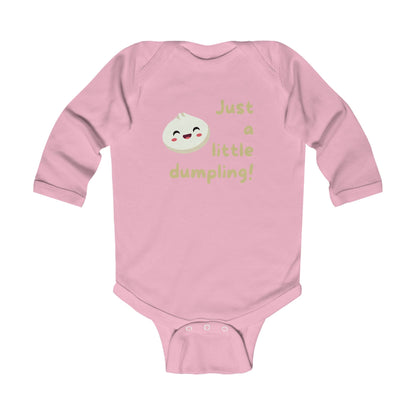 On the front of this custom infant onesie are the words Just A Little Dumpling with a image of a bao dumpling with a happy face next to the wording.