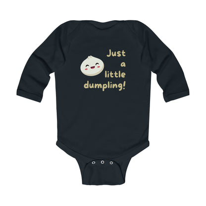 On the front of this custom infant onesie are the words Just A Little Dumpling with a image of a bao dumpling with a happy face next to the wording.