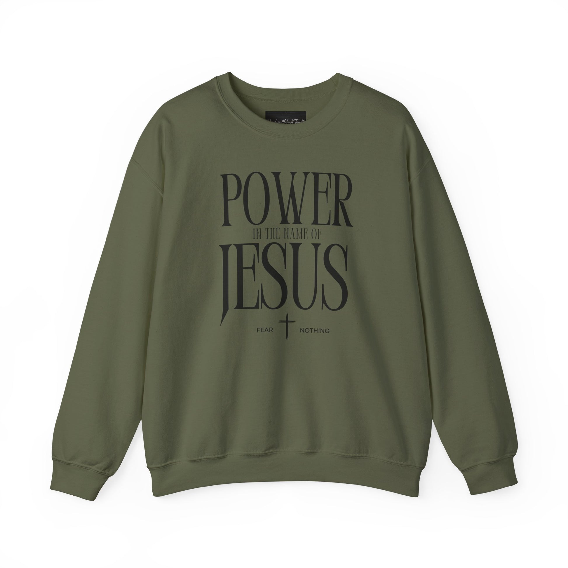 On the front of this Christian pullover sweatshirt it says Power In The Name Of Jesus with a Jesus cross underneath it, on either side of the cross are the words Fear and Nothing.